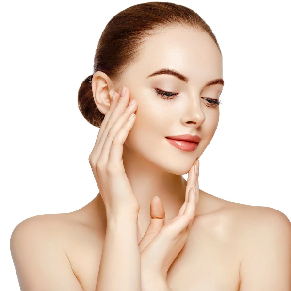 A woman with clear skin and light makeup touches her face with both hands, posing against a white background, embodying the benefits of antioxidant therapy in Nepal.