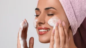 Beautiful Woman Applying Facial Cleansing Foam
