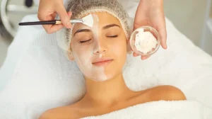 Dermatologist Putting Moisturizing Mask to Womans Face during Skincare Procedure