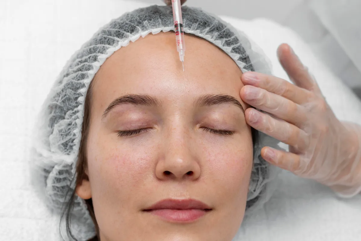 doctor performing vampire facial in young women